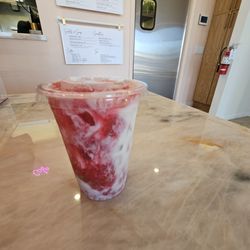 Rose Cafe - Hibiscus rose cold brew made with almond milk, but they do offer regular and oat in replace of.