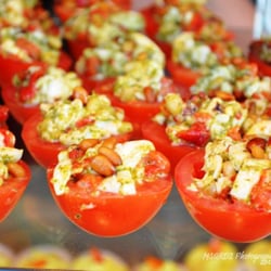 Sapphire Catering - Stuffed Tomato Appetizer--with pesto, fresh mozzarella, and pine nuts
