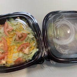 a salad in a plastic container