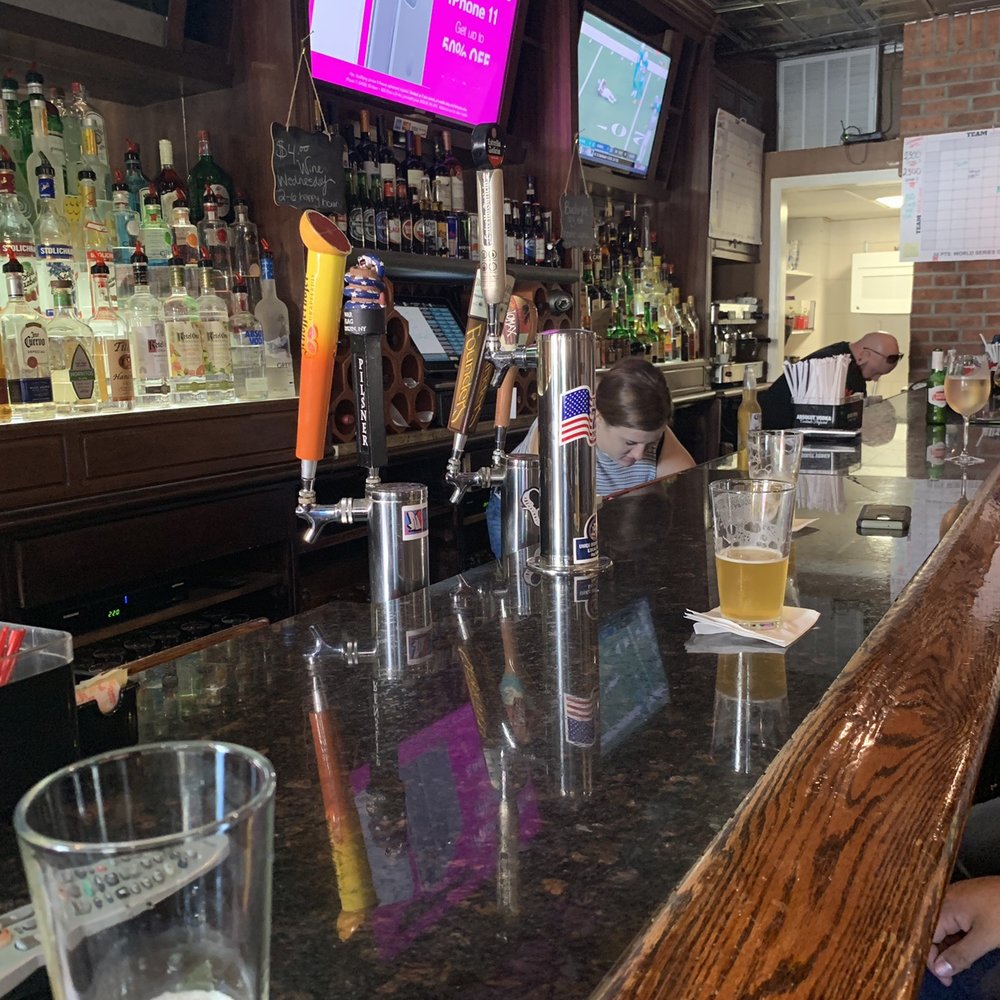 Space 303 - a bar with people sitting at the bar - Bars Near Me - Mineola, New York