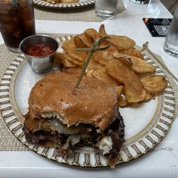 The Grille - Burger and chips, which I already took a bite out of. - American Near Me - East Elmhurst, New York The Grille - Burger and chips, which I already took a bite out of. - American Near Me - East Elmhurst, New York