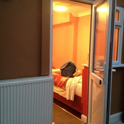 Cherry Court Hotel - From the foyer into the basement bedroom containing 4 beds.
