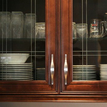 Sun Kitchen and Bath - a cabinet with dishes and glasses - General Contractors Near Me - Bellingham, Washington