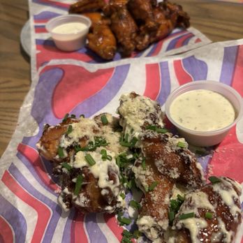 Mellow Mushroom Raleigh - Garlic Parmesan wings and hot buffalo - Pizza Near Me - Raleigh, North Carolina