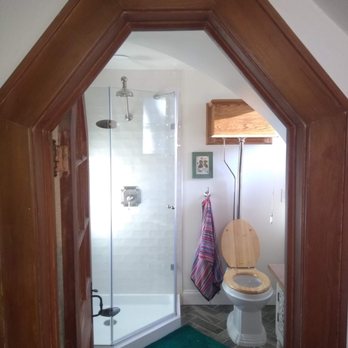 Fleming Contracting - a bathroom with a toilet and shower - General Contractors Near Me - Yorktown Heights, New York