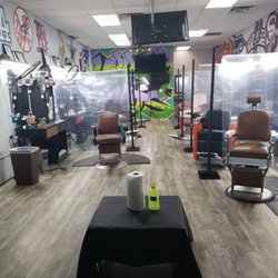 Uppercuts Barbershop - Each station is 6 feet apart and separated by curtains to keep social distance.