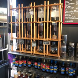 shelves of coffee and condiments shelves of coffee and condiments