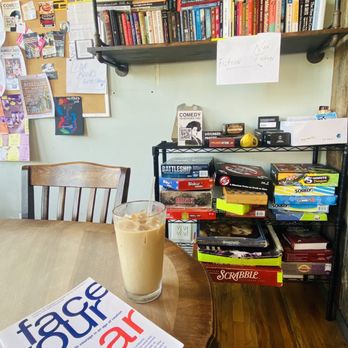 Daily Press Coffee and Bar - a book on a table - Coffee & Tea Near Me - Brooklyn, New York