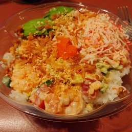 Custom bowl with mani, salmon, tuna, shrimp, avocado, mass to, garlic, onions, kani salad....