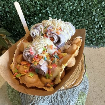 Roll & Bowl - Ube rolled ice cream on bubble waffle with condensed milk, shredded coconut, and fruity pebbles! - Comfort Food Near Me - Alameda, California