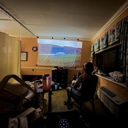 Belleair East Health Care Center - Projecting movie on wall