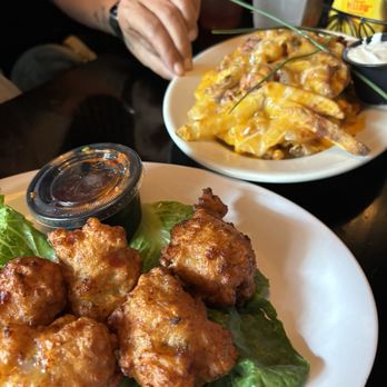 Delaney's Irish Pub & Grill - Conch fritters and cheese fries - Seafood Near Me - Cape May, New Jersey Delaney's Irish Pub & Grill - Conch fritters and cheese fries - Seafood Near Me - Cape May, New Jersey