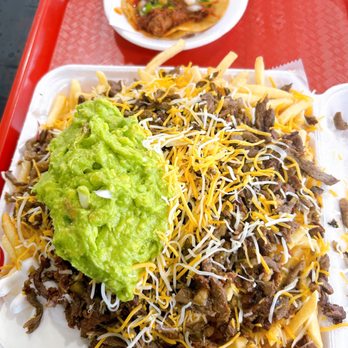 Frida’s Taqueria - a plate of nachos with guacamole - Tacos Near Me - Oceanside, California Frida’s Taqueria - a plate of nachos with guacamole - Tacos Near Me - Oceanside, California