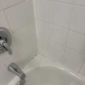Hilton Garden Inn Durham Southpoint - Caulking needed and the tub is gritty from not using soft scrub and using a low biodegradable cleaner. The tiles on the floor have chips - Hotels Near Me - Durham, North Carolina