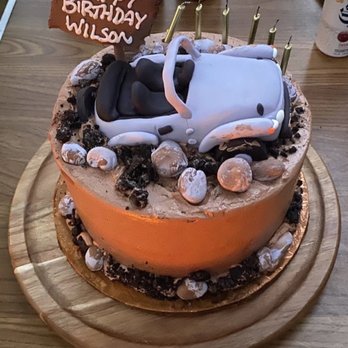 Yum Bunnies Cakery - a car on top of a cake - Custom Cakes Near Me - Waltham, Massachusetts