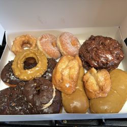 $40 for this dozen, the chocolate and maple donuts (above the chocolate chip bars) were the two extra we got for free