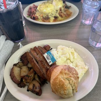 Millie's Cafe - Pasadena - Two Eggs with Choice of Meat (Egg whites, chicken apple sausage, biscuit & rosemary potatoes), Chilaquiles Benedict & Black Vanilla Latte - Breakfast & Brunch Near Me - Pasadena, California Millie's Cafe - Pasadena - Two Eggs with Choice of Meat (Egg whites, chicken apple sausage, biscuit & rosemary potatoes), Chilaquiles Benedict & Black Vanilla Latte - Breakfast & Brunch Near Me - Pasadena, California