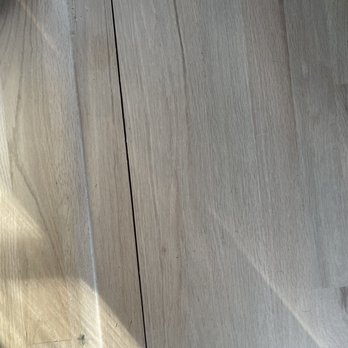 Rubirosa Contracting - a close up of a hardwood floor - Flooring Near Me Rubirosa Contracting - a close up of a hardwood floor - Flooring Near Me