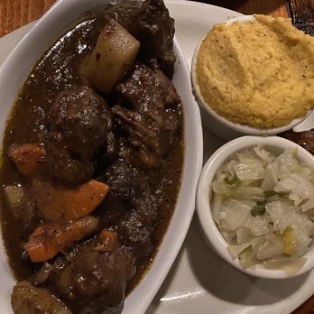 Curry n Jerk - Oxtails  Corrine's Seasoned Cabbage Grits - Caribbean Near Me - Memphis, Tennessee