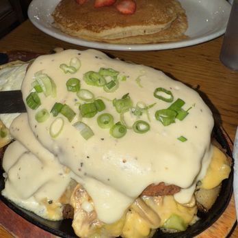 Tina's Place - Skillet with Biscuits and Gravy on a bed of potatoes/ eggs! - Breakfast & Brunch Near Me - Pinole, California Tina's Place - Skillet with Biscuits and Gravy on a bed of potatoes/ eggs! - Breakfast & Brunch Near Me - Pinole, California