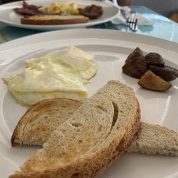 Early Birds Diner - Two eggs over medium, 1 piece of rye toast and a 5 potatoes...he did bring out more potatoes when I complained.