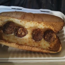 Manny & Olga's Pizza - A burnt meatball and cheese sub without any cheese or marinara sauce. This sandwich is obviously inedible.