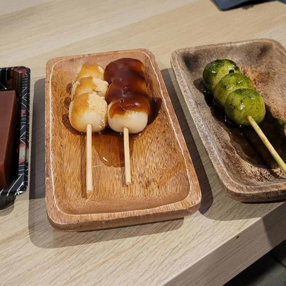 From left to right: Mizu yokan (red bean jelly-like dish),  Kinako dango (mochi), Mitarashi dango, matcha dango