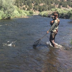 Bucking Trout Outfitters - Hooked up and netting... on a full day guide trip