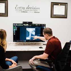 LiveFree Health - Dr. Tyler explaining a patient's issues on her X-rays.