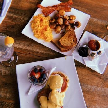 The Chalkboard Kitchen + Bar - Eggs Benedict with side fruit & The American - New American Near Me - Tulsa, Oklahoma The Chalkboard Kitchen + Bar - Eggs Benedict with side fruit & The American - New American Near Me - Tulsa, Oklahoma