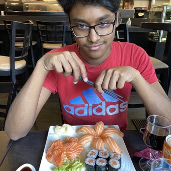 Shuriken - Ash eating one of the sushi plates at the restaurant. - Sushi Bars Near Me - Marseille, 13