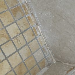 Shoddy/Lazy Workmanship, didn't remove old grout, covered with caulk which didn't allow me to check their work.