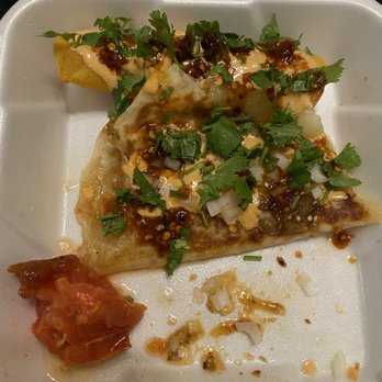 Pobres Tacos - My last piece of quesadilla and a potato taquito. Being a vegetarian, I highly appreciate them accommodating me. SO GOOD!!! - Tacos Near Me - Los Angeles, California