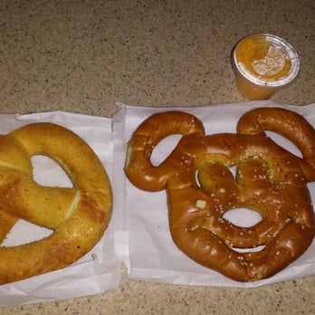 Refreshment Corner - Cream cheese pretzel ($3.79) & Mickey pretzel with cheese dipping sauce - Food Stands Near Me - Anaheim, California