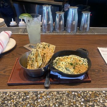 Whiskey Cake Kitchen Bar - My spinach and artichoke dip with flat crackers that was my appetite! Served very hot in an iron! - American Near Me - Oak Ridge North, Texas Whiskey Cake Kitchen Bar - My spinach and artichoke dip with flat crackers that was my appetite! Served very hot in an iron! - American Near Me - Oak Ridge North, Texas