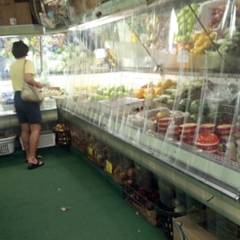 Island General Store - a woman shopping for fruit - Grocery Near Me - Put-in-Bay, Ohio Island General Store - a woman shopping for fruit - Grocery Near Me - Put-in-Bay, Ohio