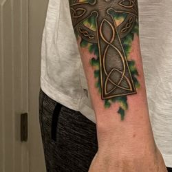 Bonaroo Tattoo - An homage to my Irish, Scottish and Welsh roots. Pagan & Christian roots linked to the sun, 4 directions & 4 elements. Amazing work w color!