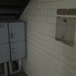 1st photo. Bare wall where the outgoing mail box used to be.