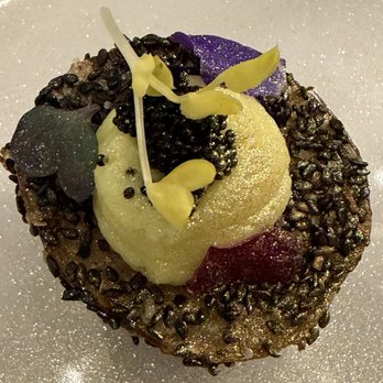The Dan - Potato topped with black sesame and caviar - Cocktail Bars Near Me - Tampa Bay, Florida The Dan - Potato topped with black sesame and caviar - Cocktail Bars Near Me - Tampa Bay, Florida
