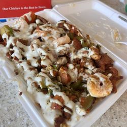 New York Fried Chicken - Chicken and shrimp over rice with a bunch of the white sauce. You can also get it spicy. I'm trying that next go around