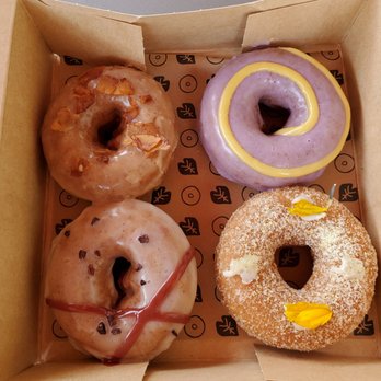Holey Grail Donuts - Top Left - Reincarnated, Top Right - Purple Haze, Bottom Left - Lydgate Farms, and Bottom Right - L&L - Donuts Near Me - Honolulu, Hawaii Holey Grail Donuts - Top Left - Reincarnated, Top Right - Purple Haze, Bottom Left - Lydgate Farms, and Bottom Right - L&L - Donuts Near Me - Honolulu, Hawaii