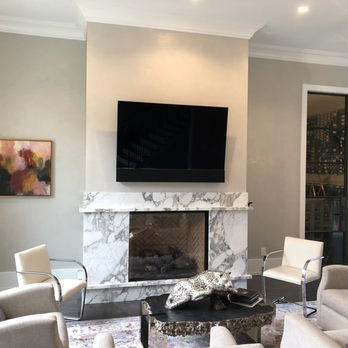Digital Delight - Beautiful formal living room set-up w/ OLED TV complemented by a SONOS playbar mounted inside a custom cut Leon Tonecase controlled Logitech - Home Theatre Installation Near Me - Houston, Texas Digital Delight - Beautiful formal living room set-up w/ OLED TV complemented by a SONOS playbar mounted inside a custom cut Leon Tonecase controlled Logitech - Home Theatre Installation Near Me - Houston, Texas