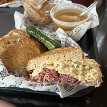 Zingerman's Delicatessen - Zingerman's Reuben (unmatched) with a new pickle. A bowl of delicious Kreplach ( their famous chicken broth with one brisket dumpling). - Delis Near Me - Ann Arbor, Michigan Zingerman's Delicatessen - Zingerman's Reuben (unmatched) with a new pickle. A bowl of delicious Kreplach ( their famous chicken broth with one brisket dumpling). - Delis Near Me - Ann Arbor, Michigan