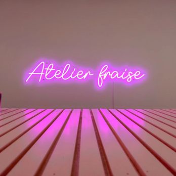 Atelier Fraise - a neon sign on a table - Patisserie/Cake Shop Near Me - Montreal, Quebec