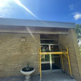 Exterior outside entrance of Grand Modern Builders - Pre sanding beam and soffit restoration Exterior outside entrance of Grand Modern Builders - Pre sanding beam and soffit restoration