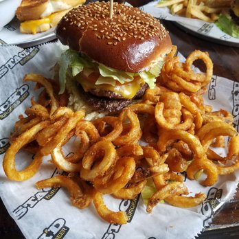 Stack'd - Sesame seed bun, 2 patties, lettuce, tomato, pickle, garlic aioli, ketchup with curly fries - American Near Me - Pittsburgh, Pennsylvania