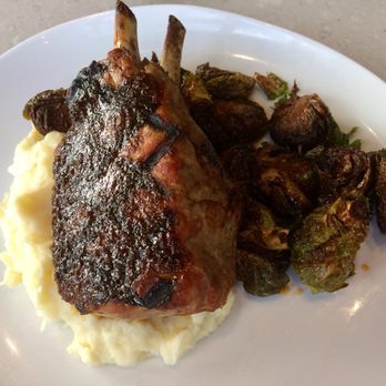 Grille 254 - Cider-brined double-cut pork chop, whipped garlic potatoes, crispy sweet and sour Brussels sprouts - American Near Me - San Antonio, Texas