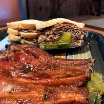 Gates Bar-B-Q - Center cut half rack of ribs and beef from the butt end on bread with pickles - Barbeque Near Me - Kansas City, Missouri Gates Bar-B-Q - Center cut half rack of ribs and beef from the butt end on bread with pickles - Barbeque Near Me - Kansas City, Missouri