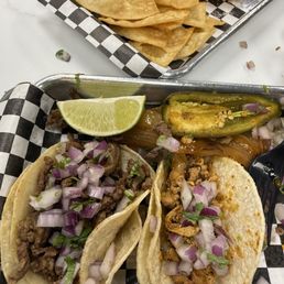 Street tacos and fresh made guacamole and chips Street tacos and fresh made guacamole and chips