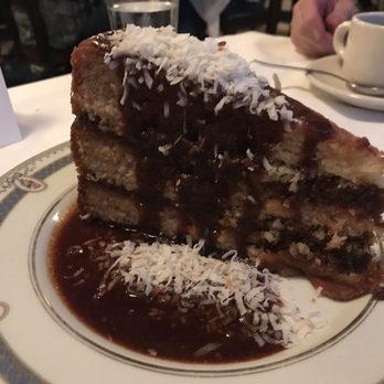 Cottage Inn Restaurant & Lodging - Coconut Pie with rum sauce! Hefty portion that was to die for. - Hotels Near Me - Eureka Springs, Arkansas Cottage Inn Restaurant & Lodging - Coconut Pie with rum sauce! Hefty portion that was to die for. - Hotels Near Me - Eureka Springs, Arkansas